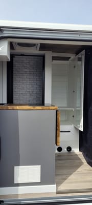 Cozy custom crafted van with Shower, Toilet, Heat, Solar and more!