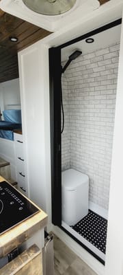 Cozy custom crafted van with Shower, Toilet, Heat, Solar and more!