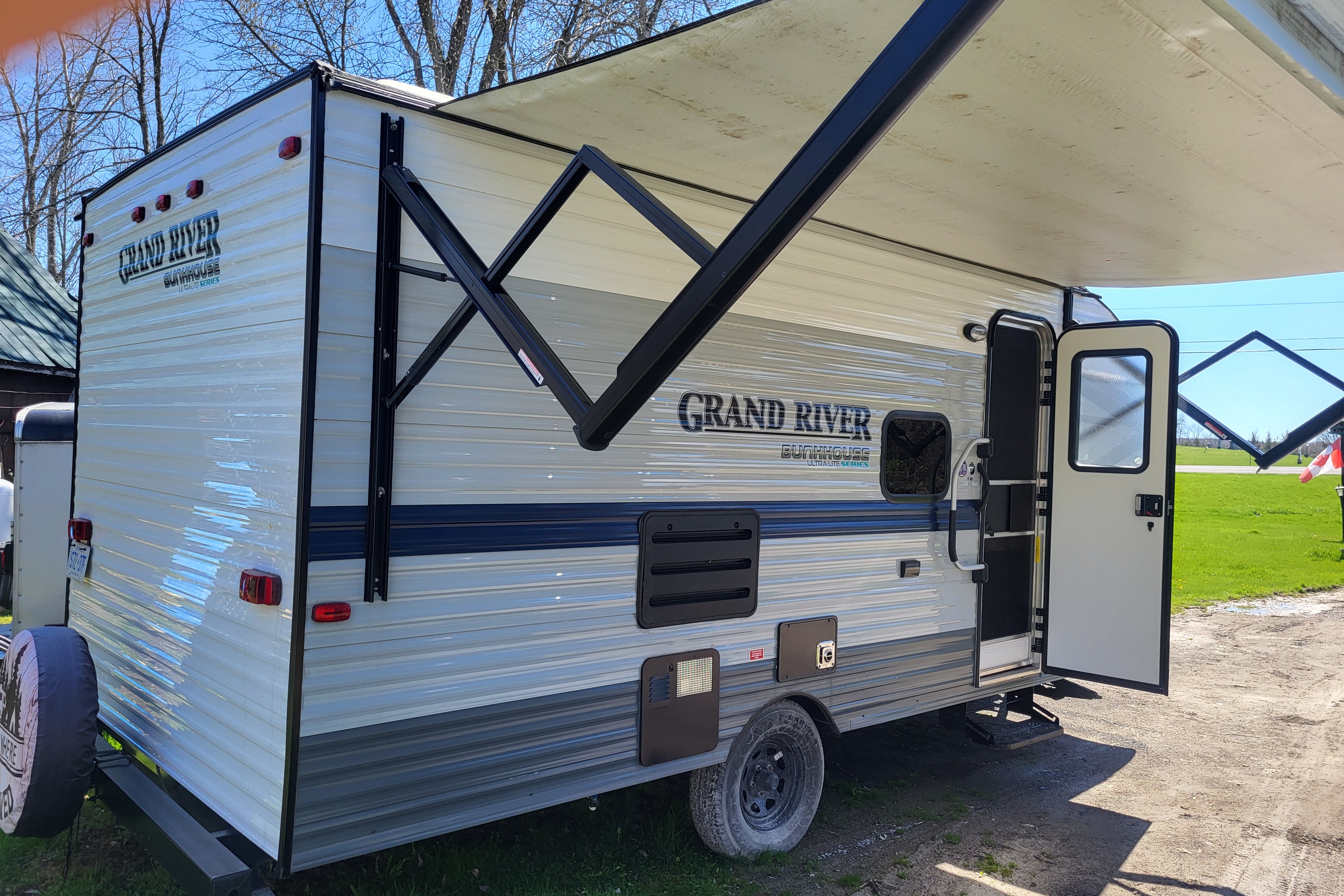 Venture in our Like New 2020 Grand River Bunkhouse Ultra-Lite Series Travel Trailer