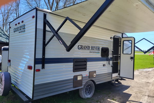 Venture in our Like New 2020 Grand River Bunkhouse Ultra-Lite Series Travel Trailer