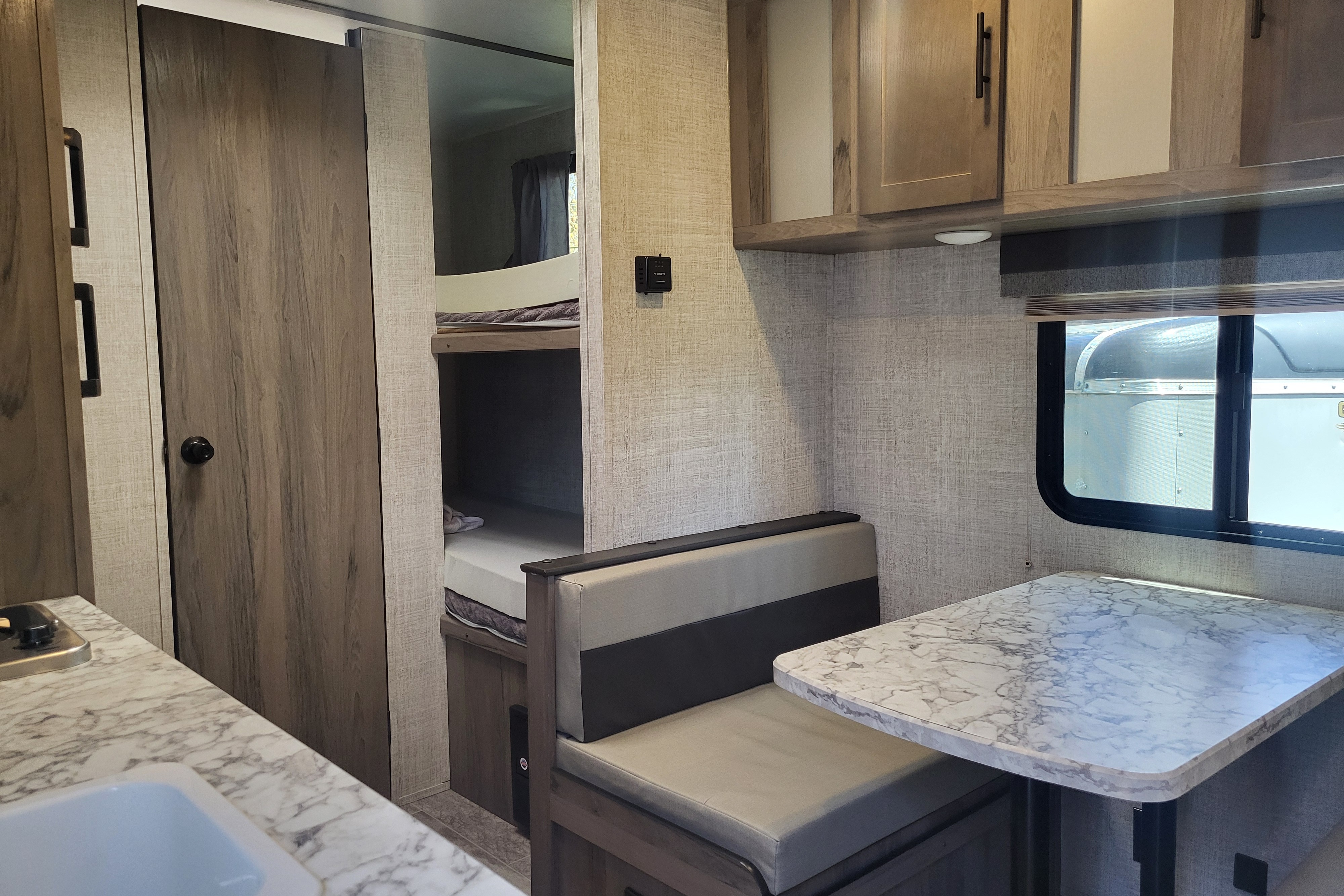 Venture in our Like New 2020 Grand River Bunkhouse Ultra-Lite Series Travel Trailer