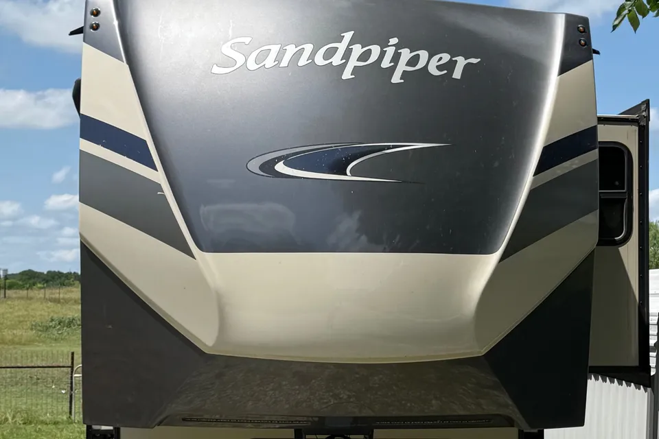 Camp with Comfort  Forest River Sandpiper 384QB0K Fifth Wheel