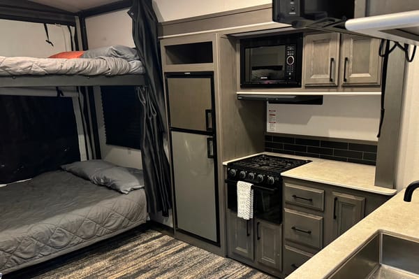 2021 30ft. Toy hauler with free kayaks and paddle boards