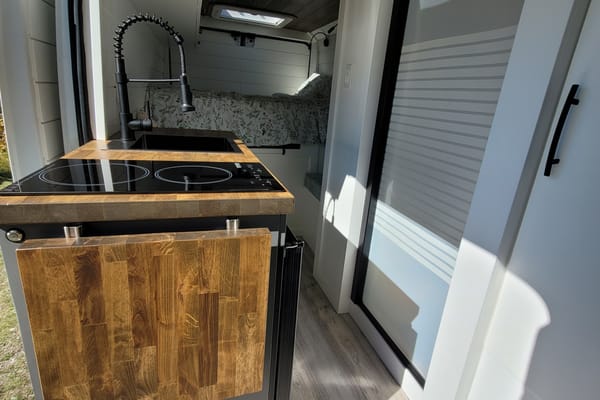 Cozy custom crafted van with Shower, Toilet, A/C , Heat, Solar and more