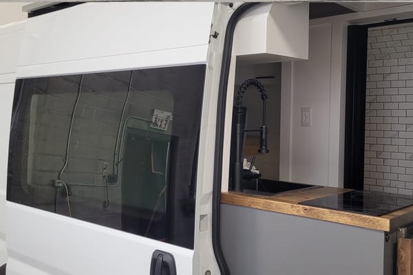 Cozy custom crafted van with Shower, Toilet, A/C , Heat, Solar and more
