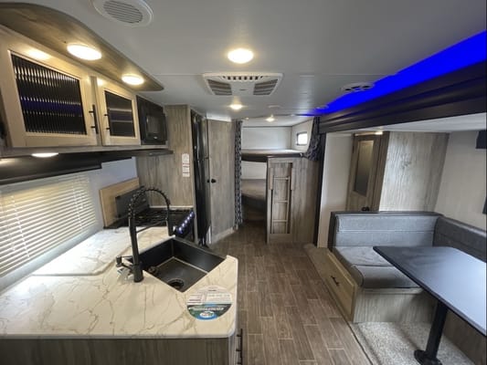 Custom stabilizers for “no rocking” while leveled Bunkhouse Trailer fully furnished and delivered