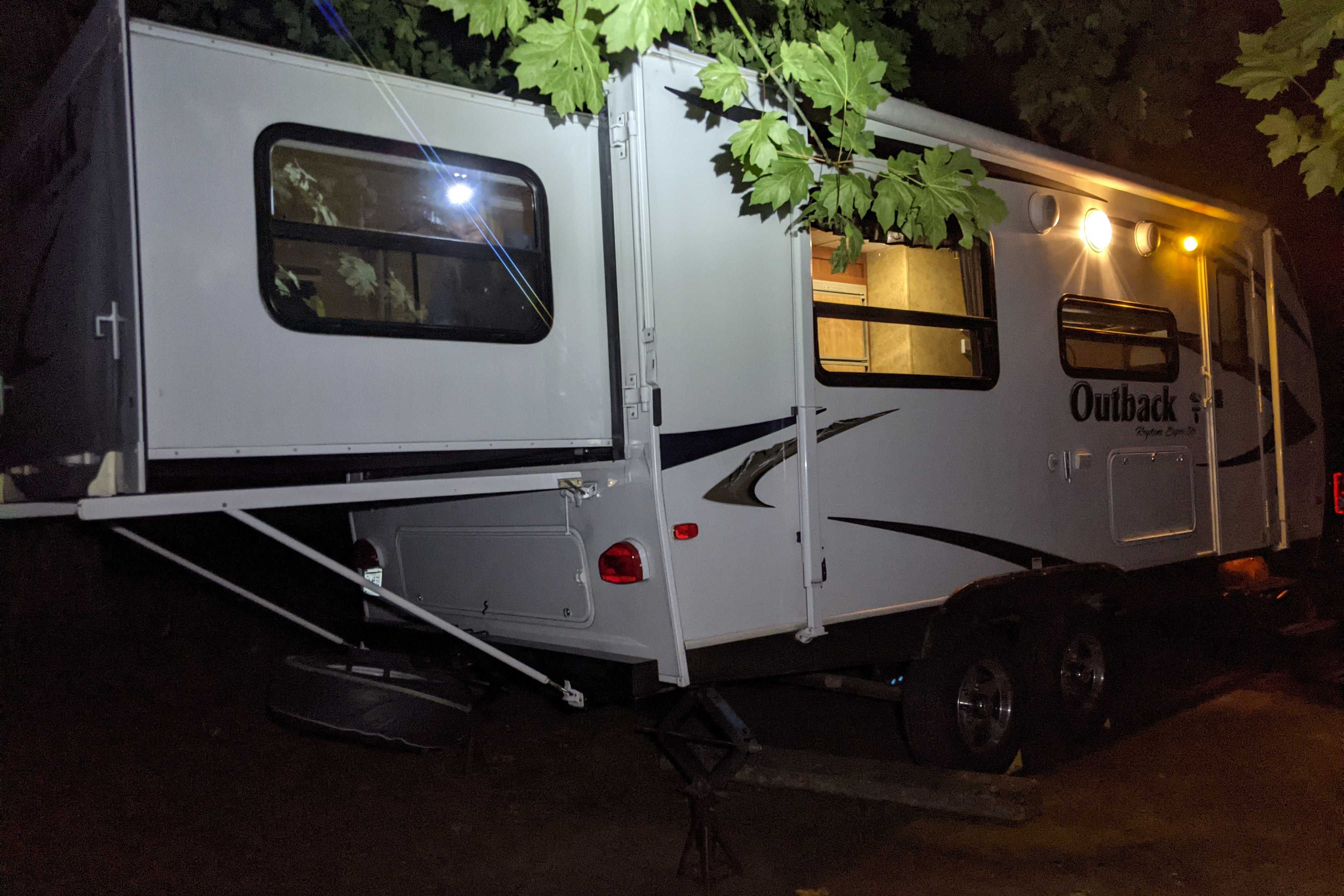 Experience Comfort and Adventure in our lightweight 2010 Keystone Outback with a king rear slide and bunk beds.
