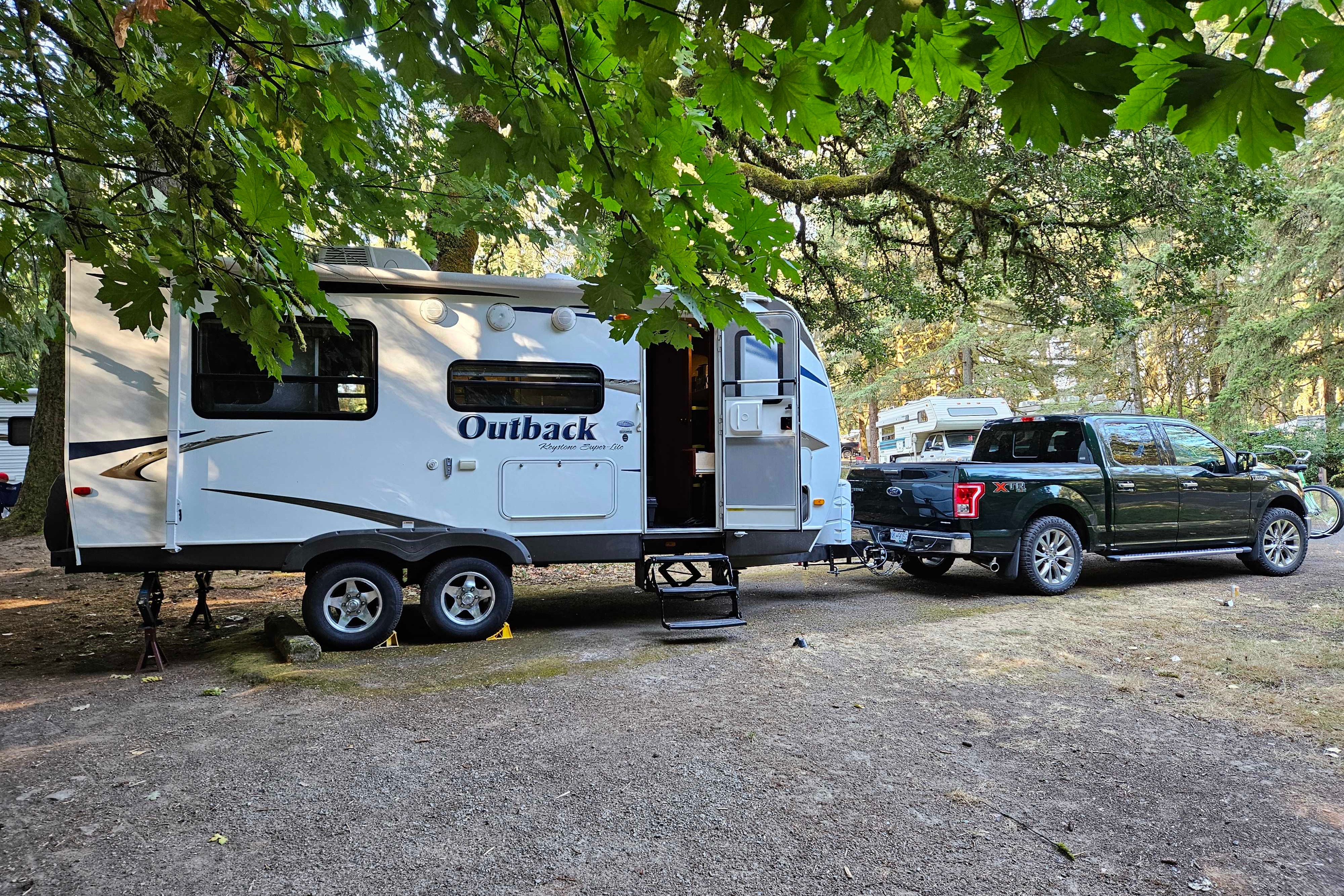 Experience Comfort and Adventure in our lightweight 2010 Keystone Outback with a king rear slide and bunk beds.