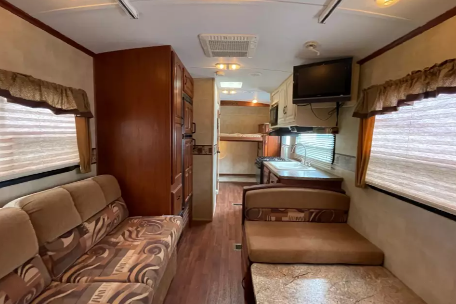 Experience Comfort and Adventure in our lightweight 2010 Keystone Outback with a king rear slide and bunk beds.