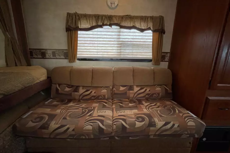 Experience Comfort and Adventure in our lightweight 2010 Keystone Outback with a king rear slide and bunk beds.