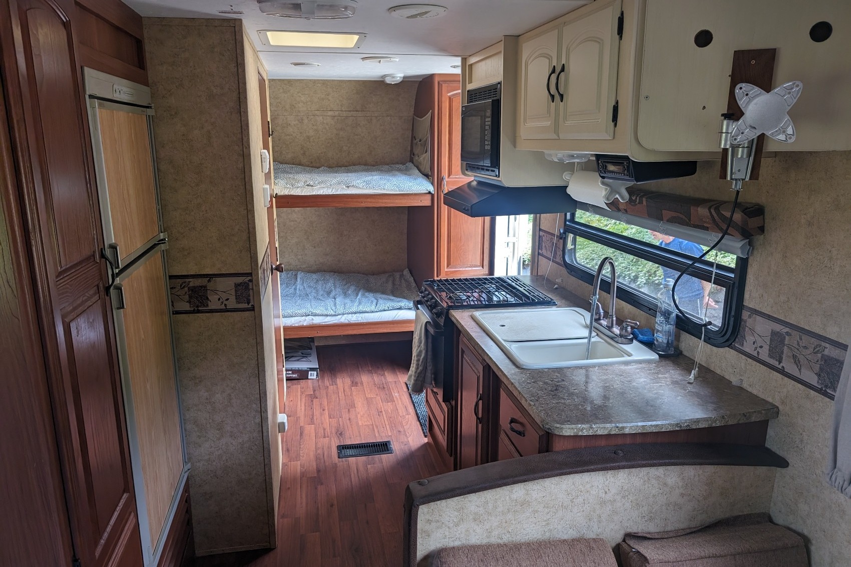 Experience Comfort and Adventure in our lightweight 2010 Keystone Outback with a king rear slide and bunk beds.