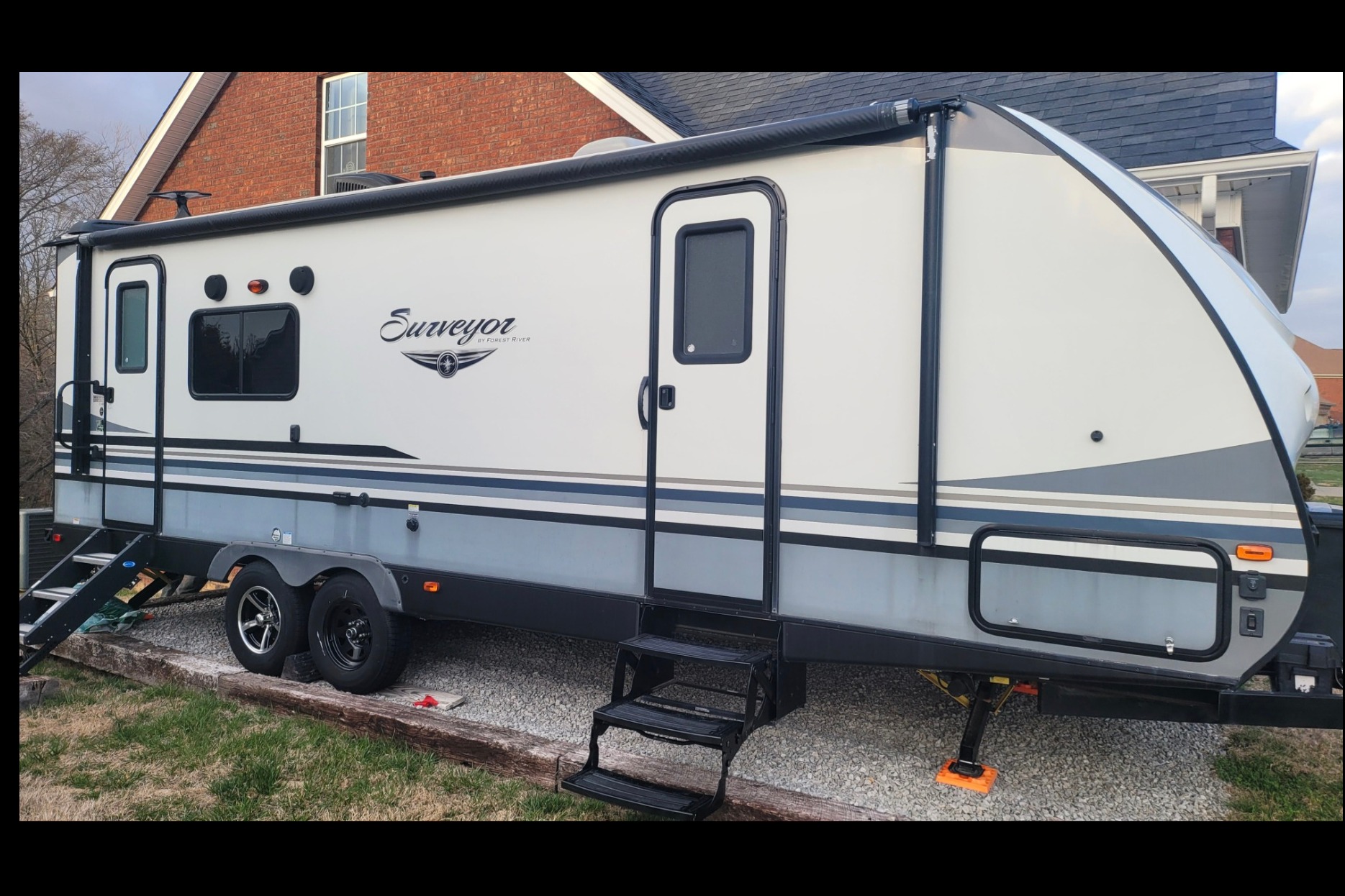 Kim & Scott's Cozy Camper (Forest River Surveyor)