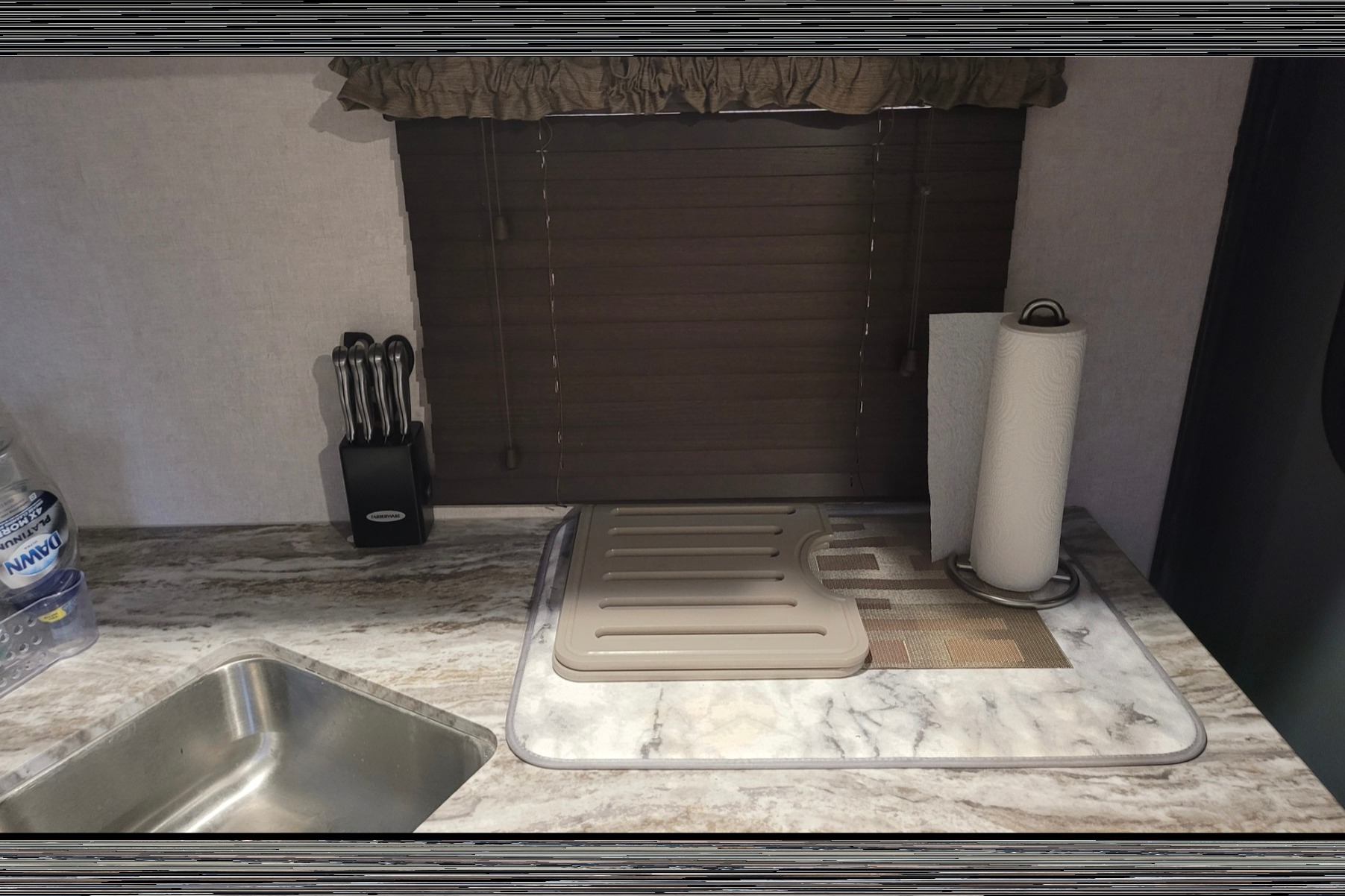 Kim & Scott's Cozy Camper (Forest River Surveyor)