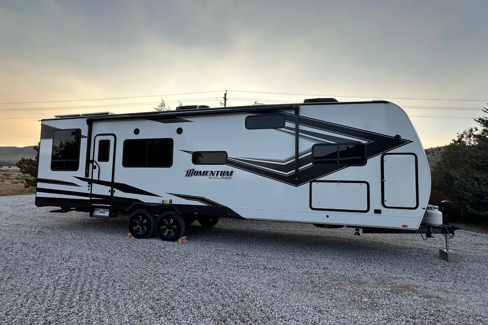 Reyes Family Grand Design Momentum 32G Toy Hauler