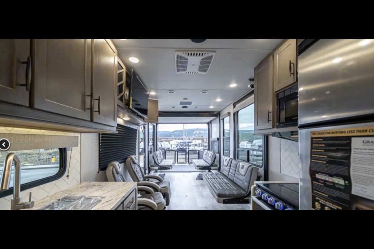 Reyes Family Grand Design Momentum 32G Toy Hauler