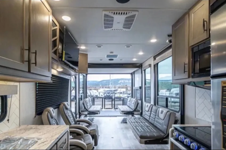 Reyes Family Grand Design Momentum 32G Toy Hauler