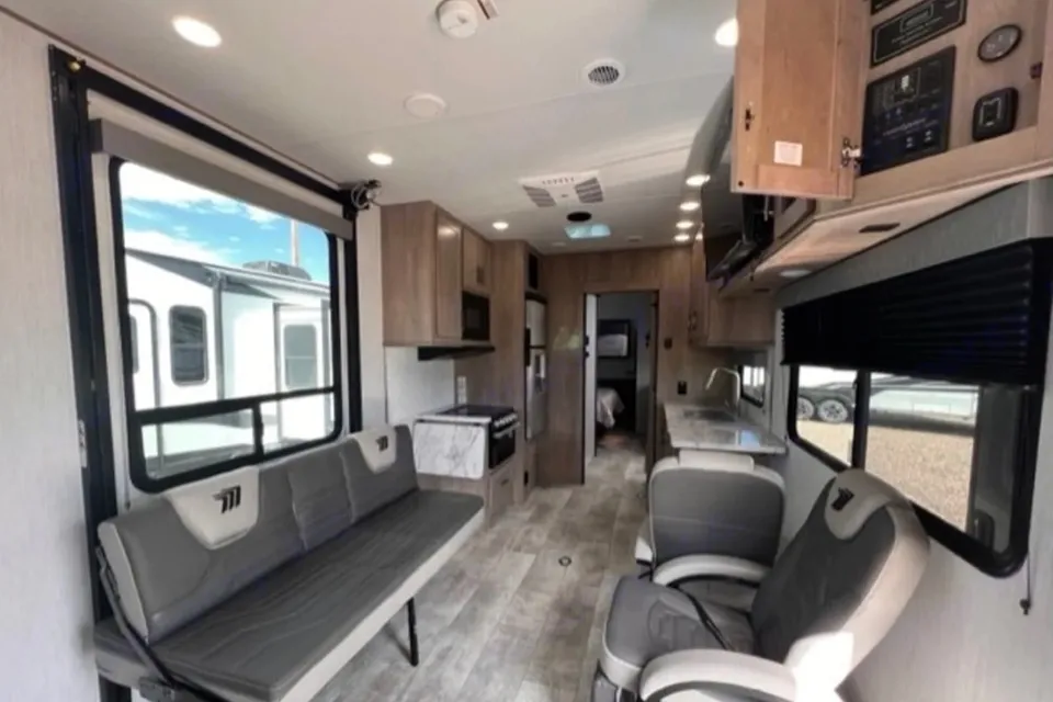 Reyes Family Grand Design Momentum 32G Toy Hauler