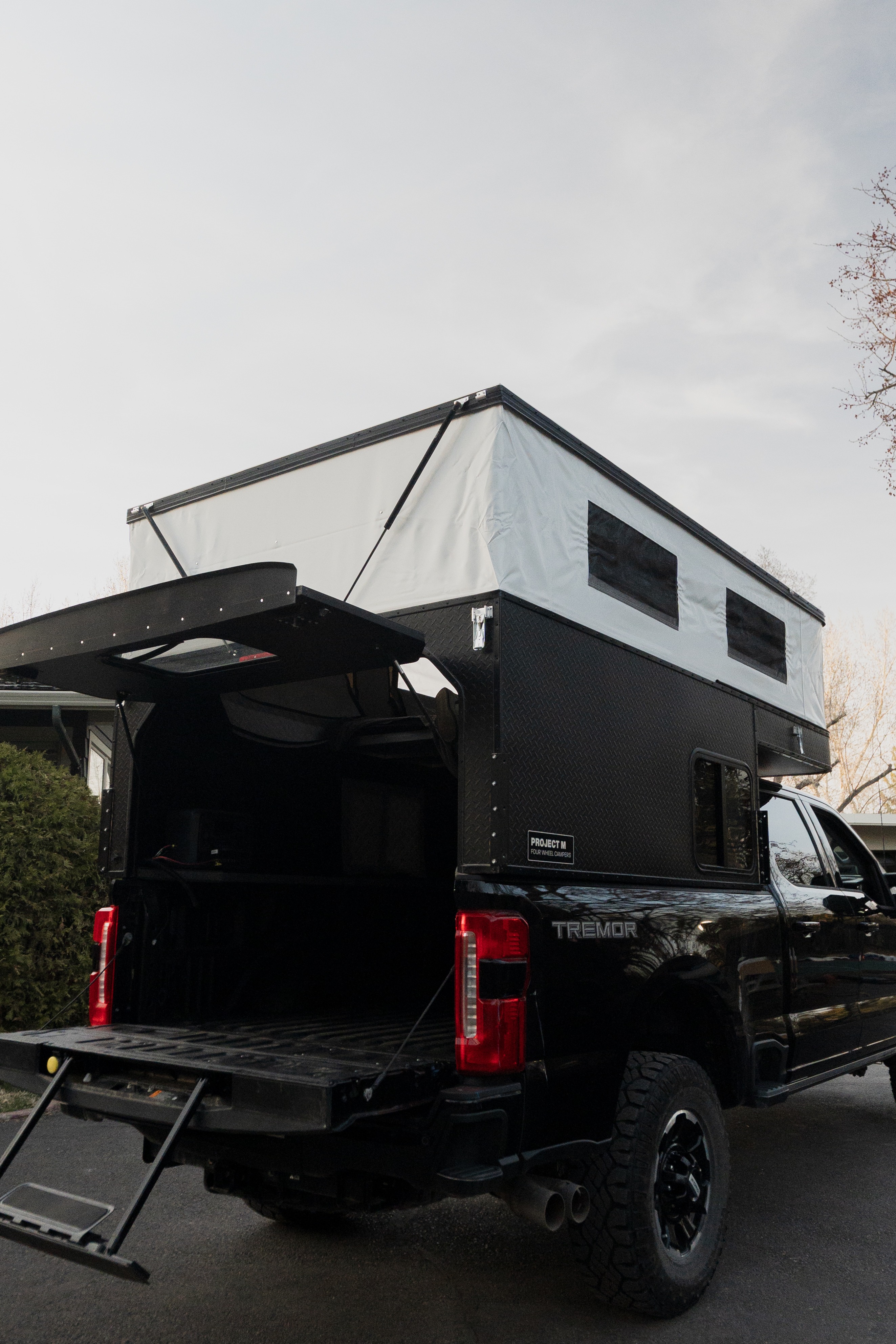 Raptor Rooftop Rentals Ford F-350 Ultimate Tremor with 4 Wheel Truck Camper