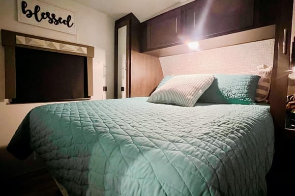 "Little home on wheels" 2020 WILDWOOD with master bedroom and bunks at the rear.