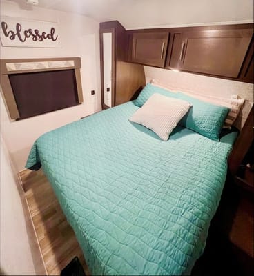 "Little home on wheels" 2020 WILDWOOD with master bedroom and bunks at the rear.