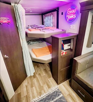 "Little home on wheels" 2020 WILDWOOD with master bedroom and bunks at the rear.