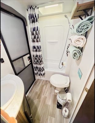 "Little home on wheels" 2020 WILDWOOD with master bedroom and bunks at the rear.