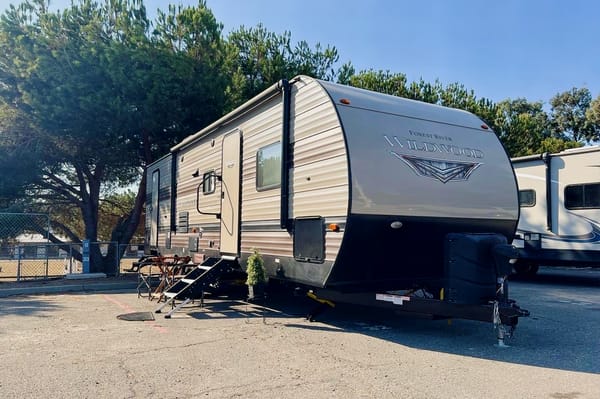 "Little home on wheels" 2020 WILDWOOD with master bedroom and bunks at the rear.