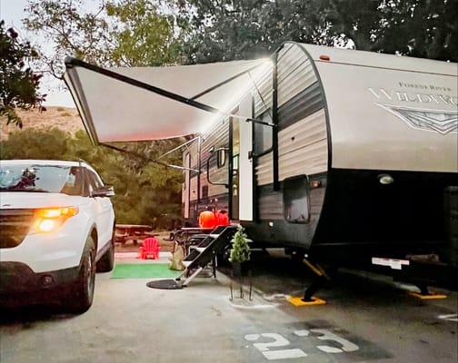 "Little home on wheels" 2020 WILDWOOD with master bedroom and bunks at the rear.