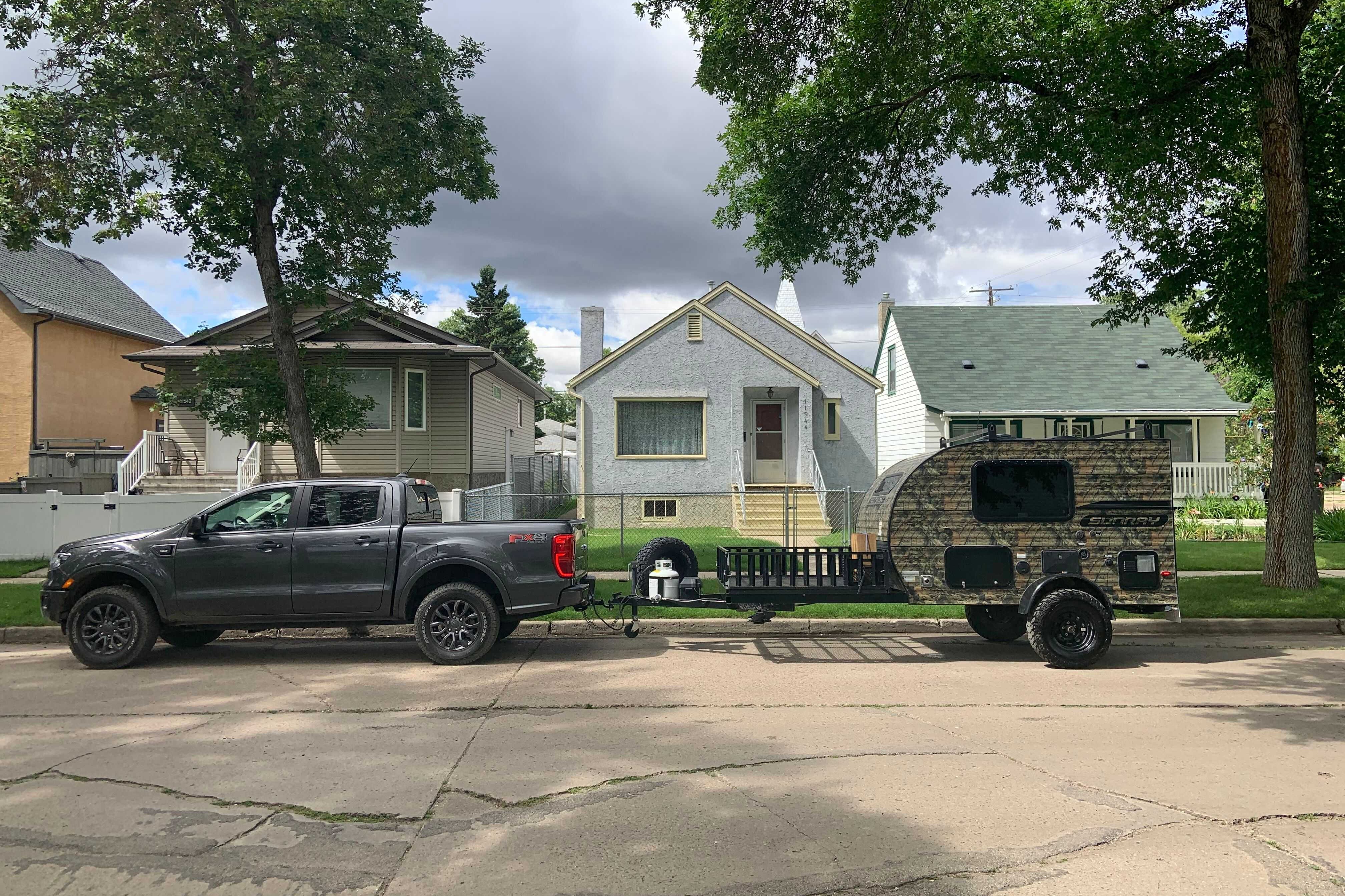 Camo Sunset Park RV Sunray Micro Trailer with toy hauler on front