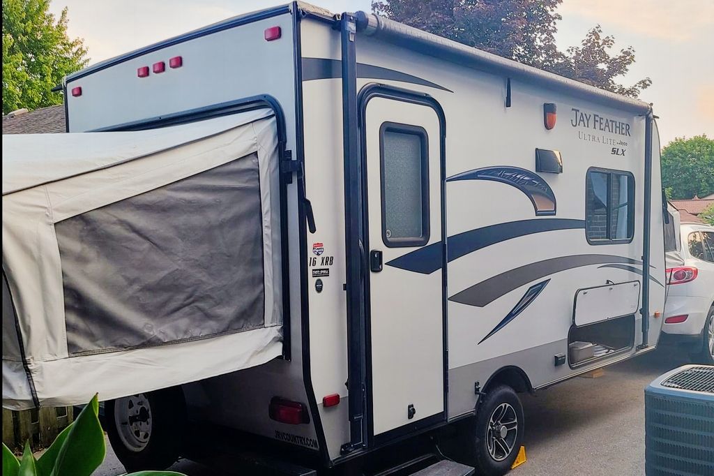 Adams Family Jayco Feather Ultra Lite SLX Hybrid