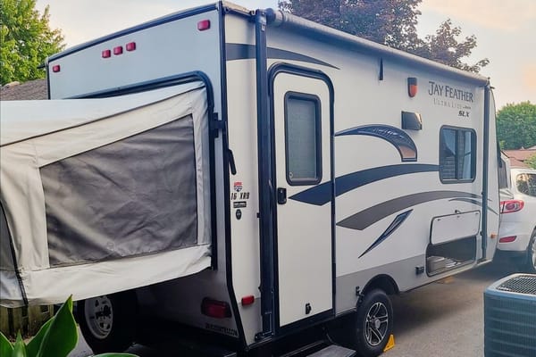 Adams Family Jayco Feather Ultra Lite SLX Hybrid