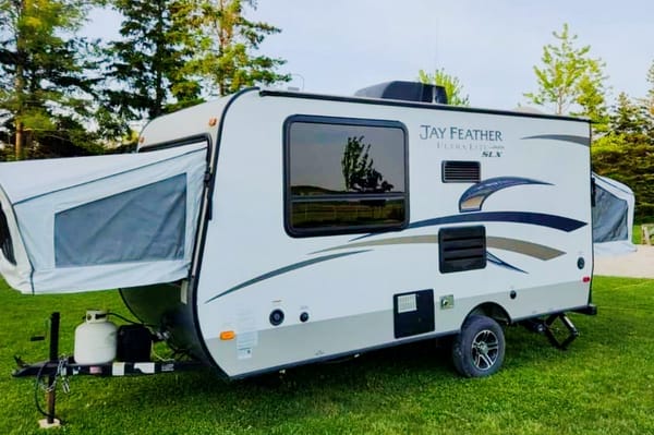 Adams Family Jayco Feather Ultra Lite SLX Hybrid