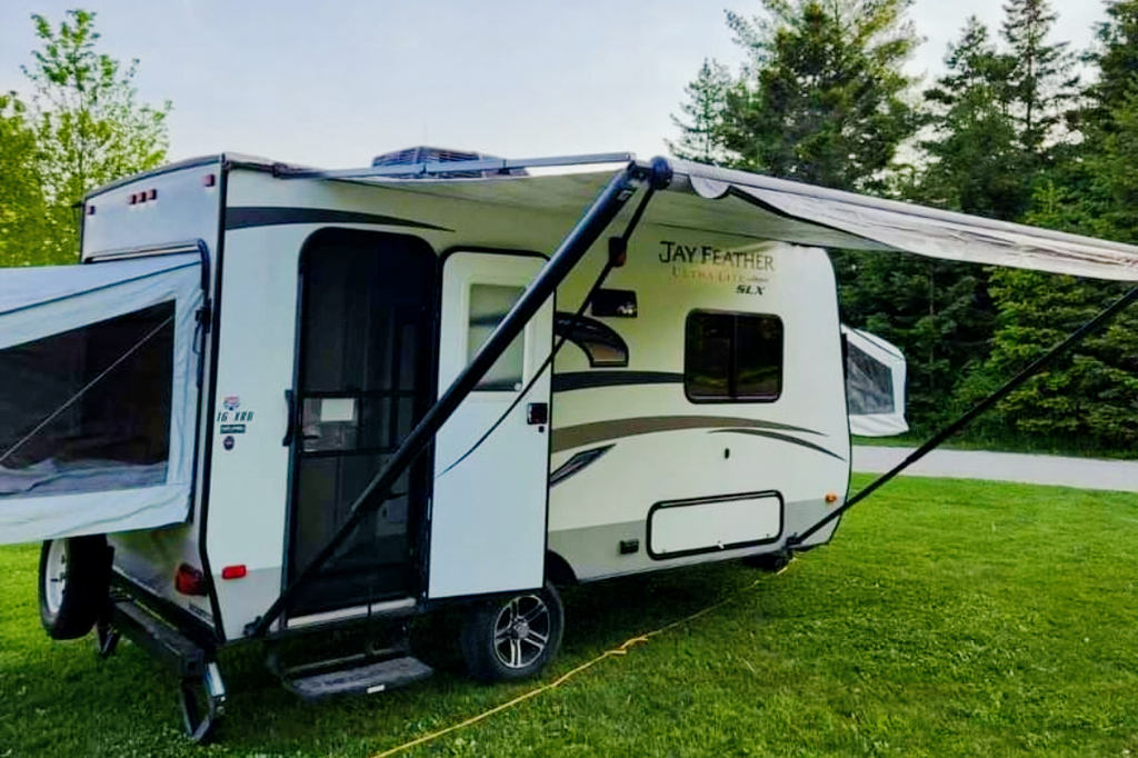 Adams Family Jayco Feather Ultra Lite SLX Hybrid