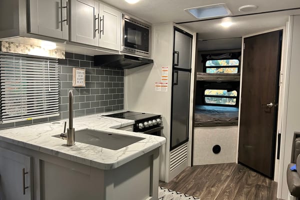 “Our Happy Place” Keystone Bullet Travel Trailer