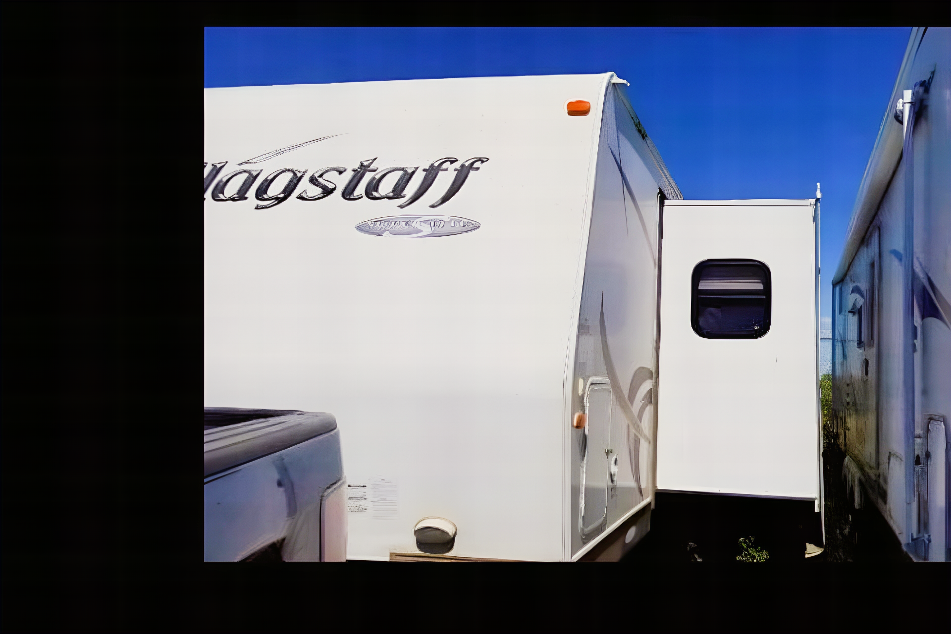 Jessica's 25’ Flagstaff  Trailer with large slide and bunk