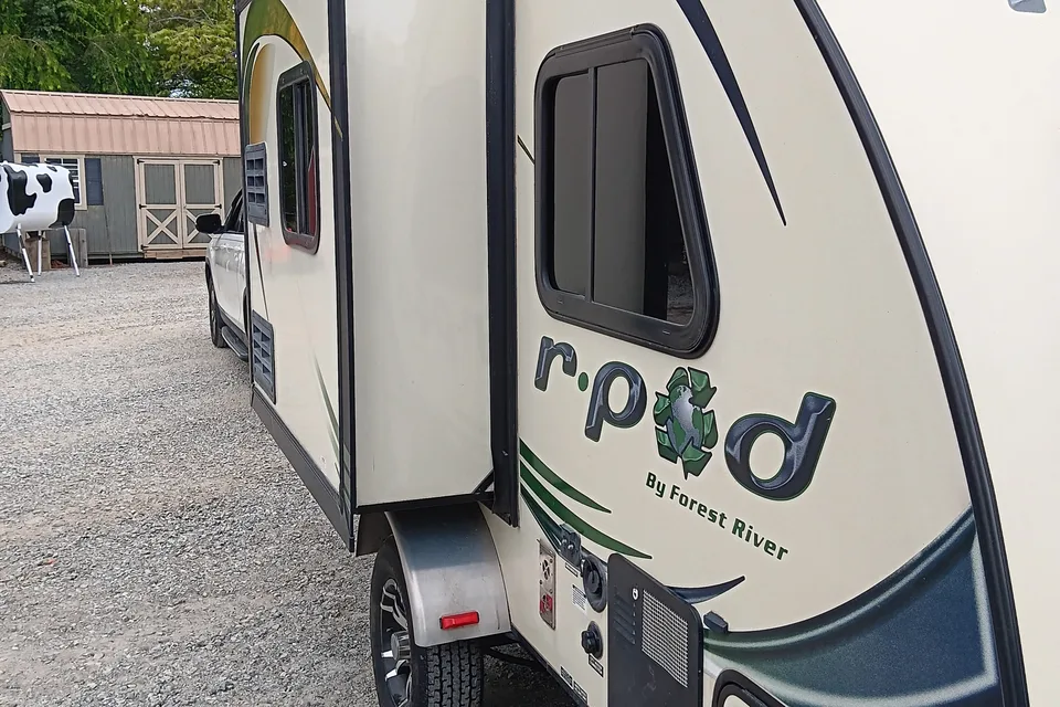 Earl 's Forest River  R POD Micro Trailer with Slider for more room.