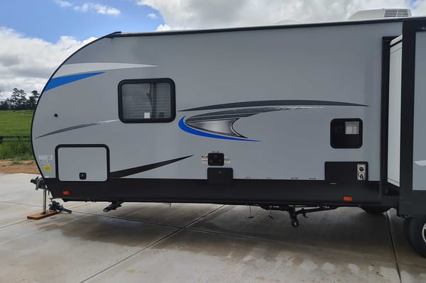 Matt and Shannon Forest River Alpha Wolf 26RL-L Travel Trailer