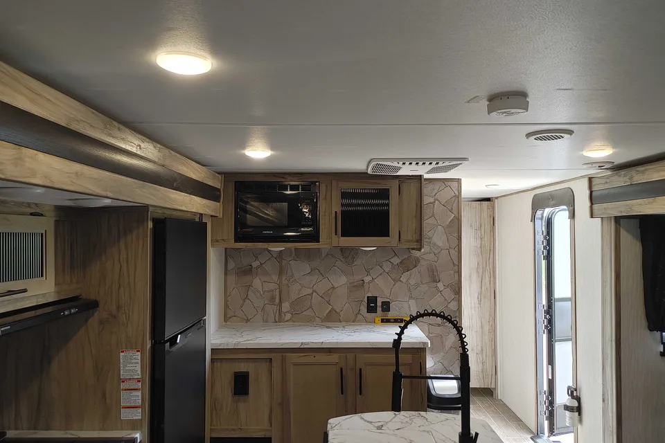 Matt and Shannon Forest River Alpha Wolf 26RL-L Travel Trailer